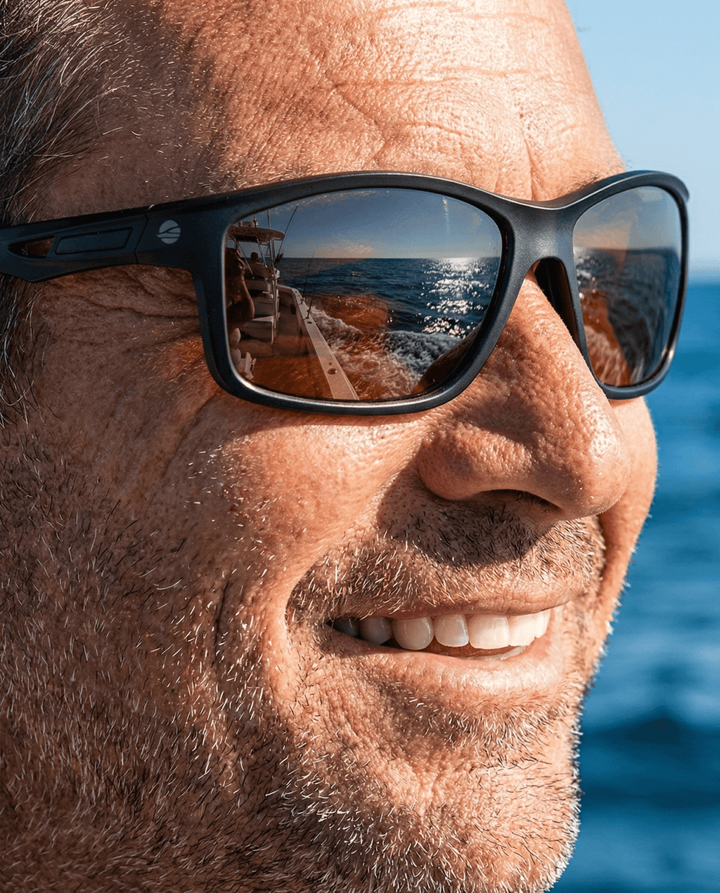 Fishing Glasses, BaitClear Horizon - Polarized sunglasses reflecting ocean view.