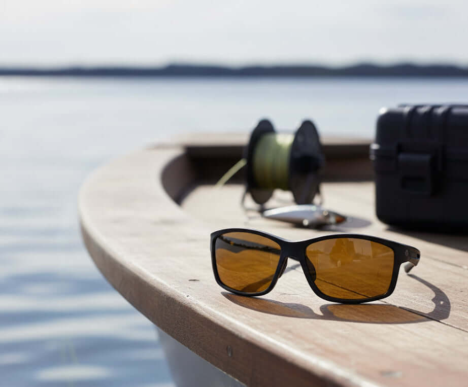 Fishing Glasses, BaitClear Horizon on a boat with fishing gear, highlighting polarized lenses for clarity.